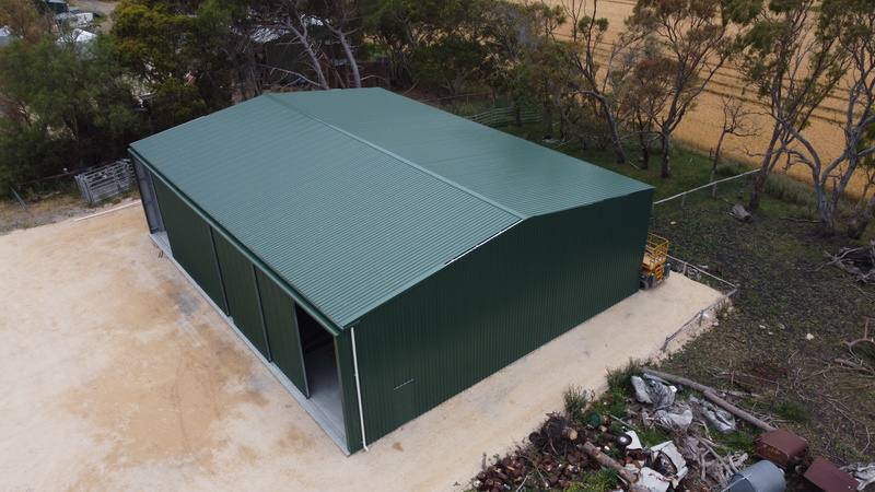Green farm shed by Blackbird Industries
