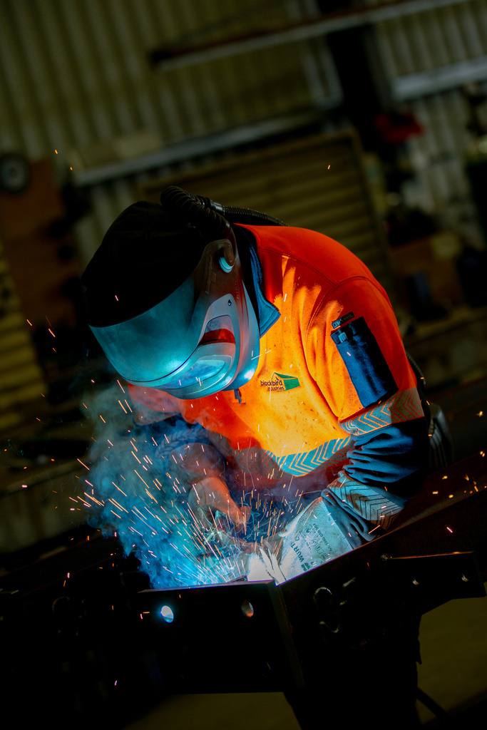 Blackbird Industries fabricator welding a shed frame in the Millicent workshop